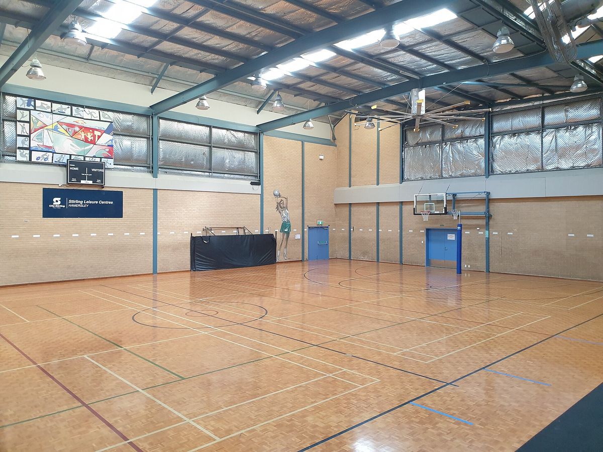 An indoor school basketball court