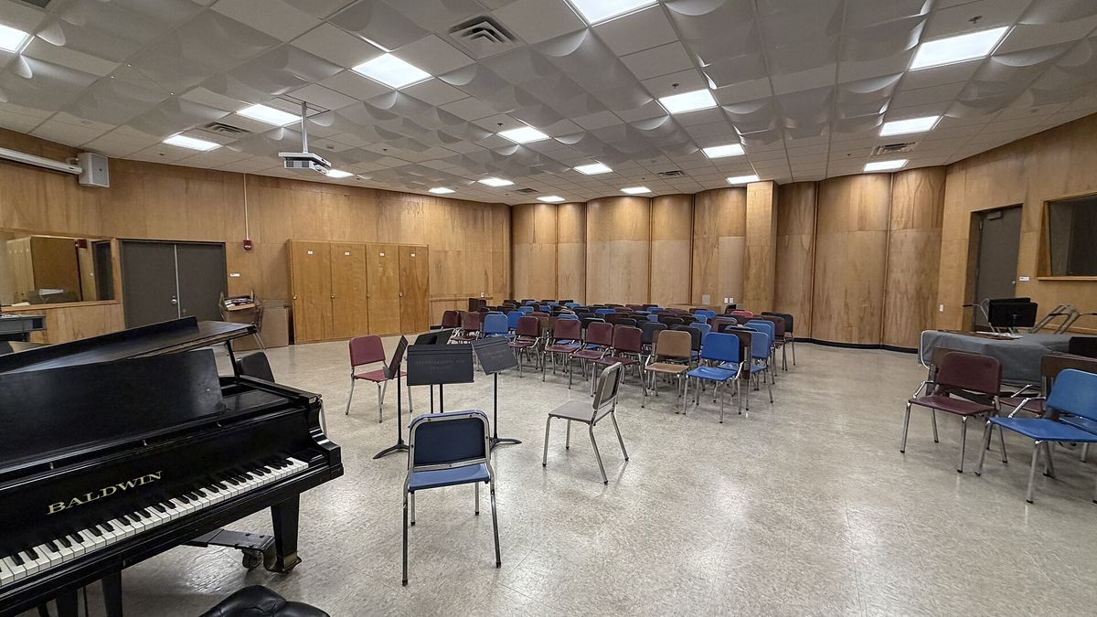 A school music room with a piano and music stands