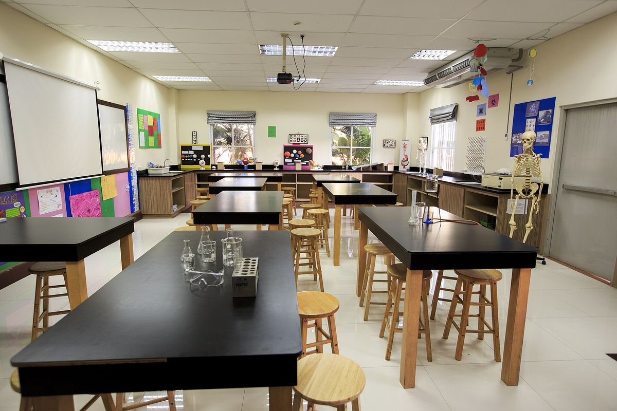 A school science laboratory with workbenches and equipment